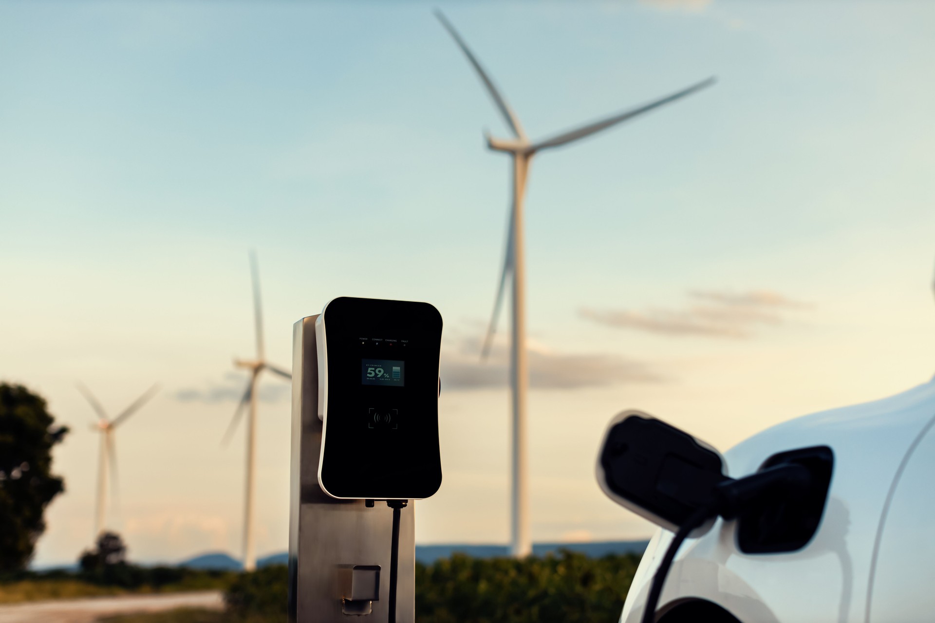 Progressive combination of EV car, charging station and wind turbine.