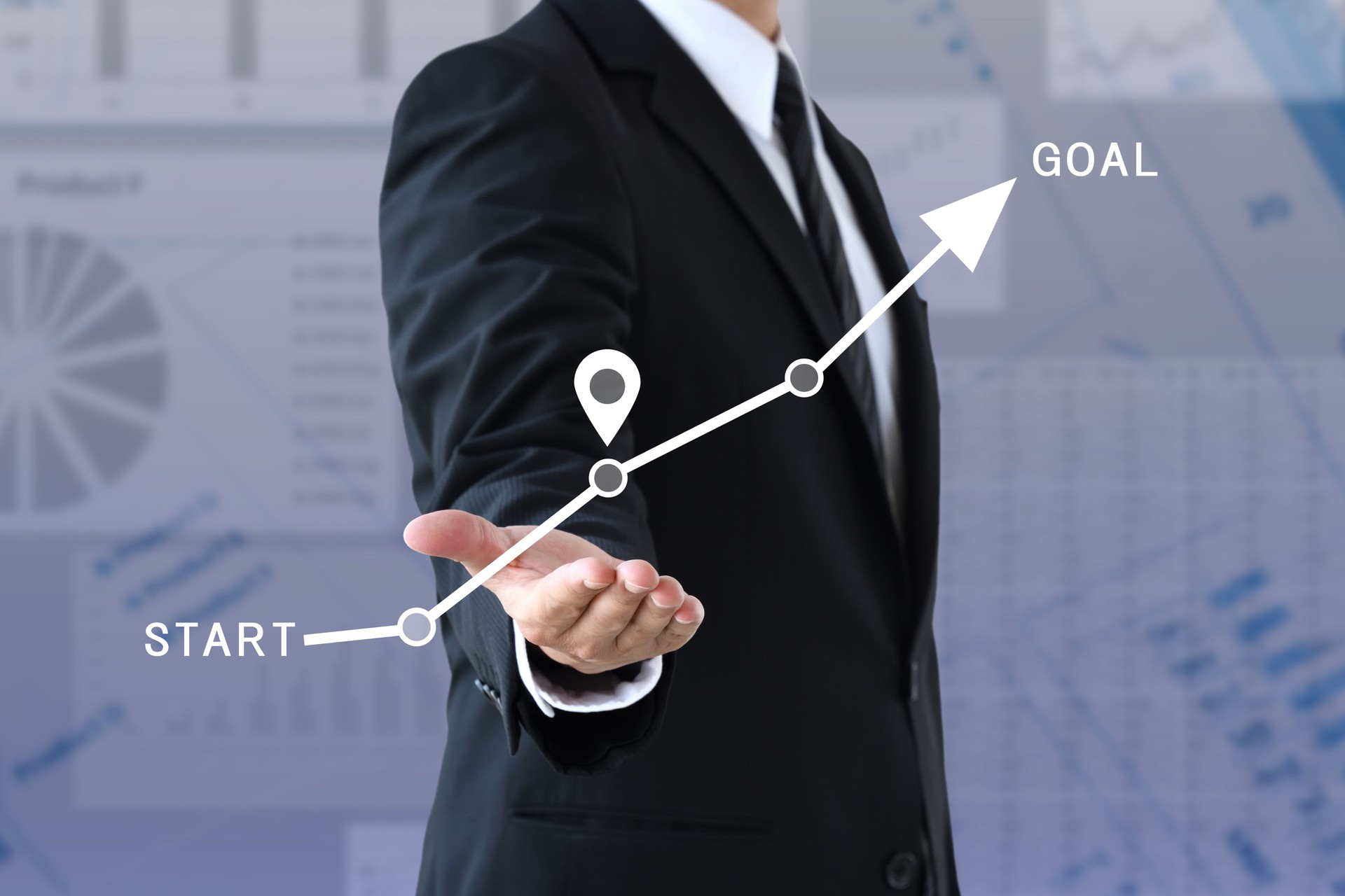 Businessman showing path from start to finish and current location